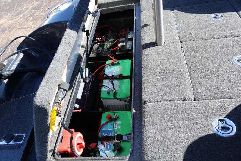 Slide: The Image of Open battery compartment of 2010 Ranger Z521 Comanche boat, showing multiple batteries and wiring. - 38