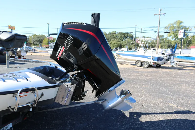 Slide: The Image of 2010 Ranger Z521 Comanche boat with Mercury Pro XS 250 engine in a parking lot. - 5
