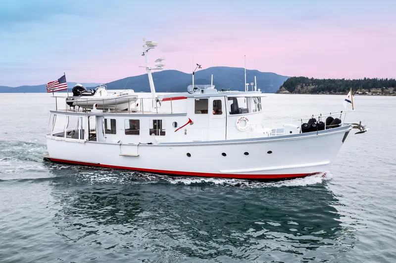 Slide: The Image of 1966 Willard Marine 47 boat cruising on calm waters at sunset. - 2