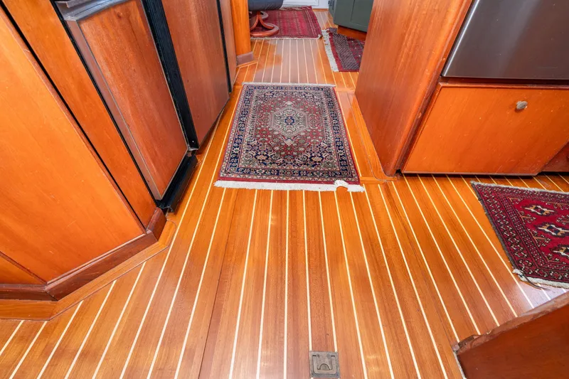 Slide: The Image of Wooden interior of 1966 Willard Marine 47 with rugs and cabinetry. - 26