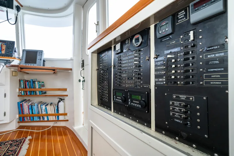 Slide: The Image of Interior of 1966 Willard Marine 47, featuring control panels and bookshelves. - 27