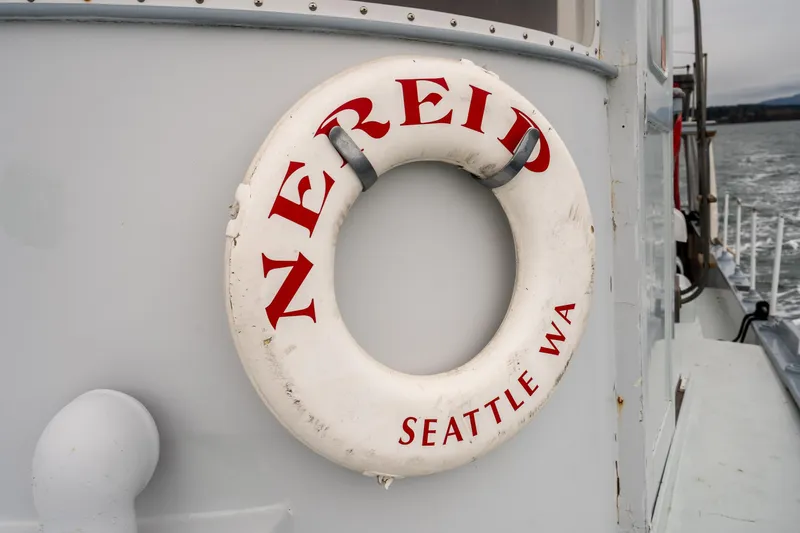 Slide: The Image of Lifebuoy on 1966 Willard Marine 47 boat, labeled "Nereid, Seattle WA." - 3