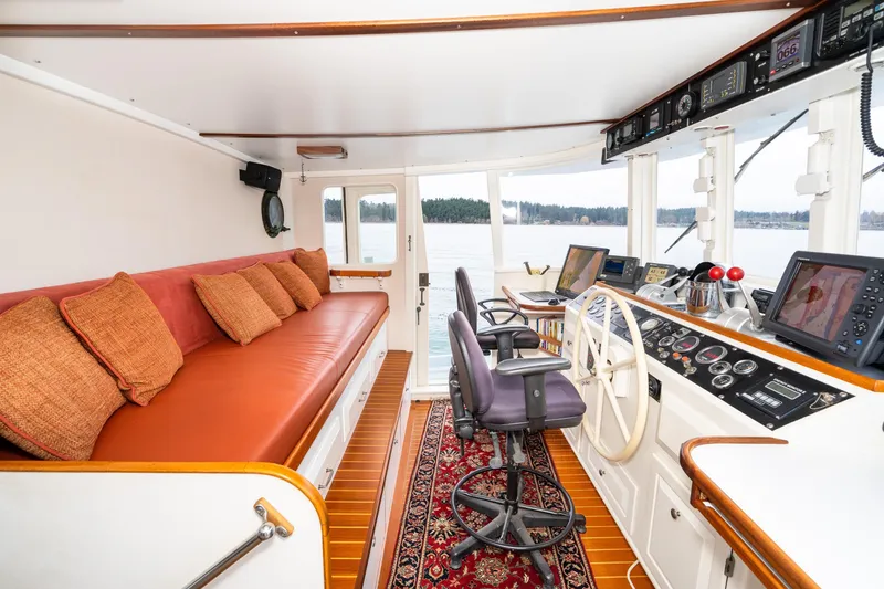 Slide: The Image of Interior of a 1966 Willard Marine 47 boat with helm, seating, and navigation equipment. - 30