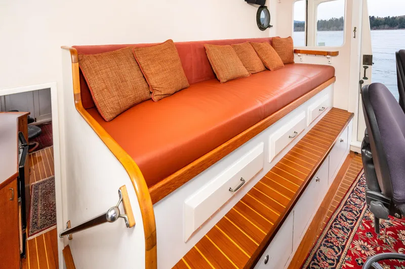 Slide: The Image of Vintage 1966 Willard Marine 47 interior with orange cushioned seating and wooden accents. - 31