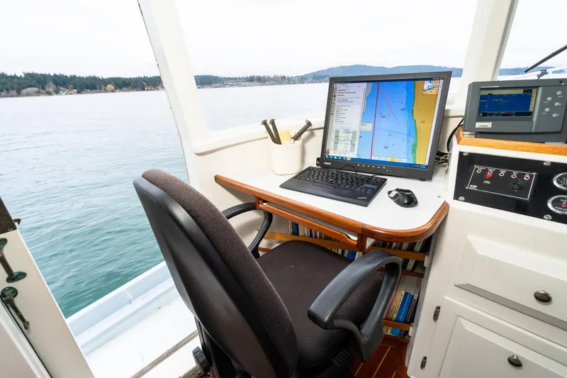 Slide: The Image of Navigation station on 1966 Willard Marine 47 boat with computer and sea view. - 34