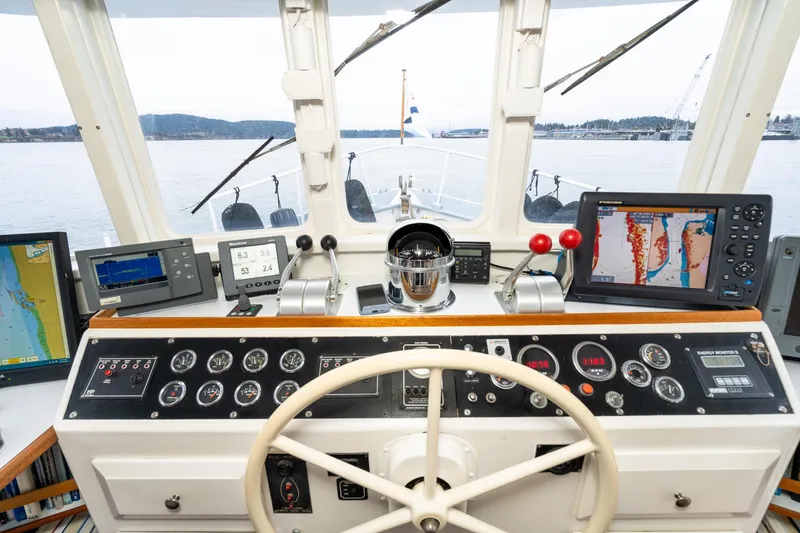 Slide: The Image of Cockpit of 1966 Willard Marine 47 boat with navigation instruments and steering wheel. - 36