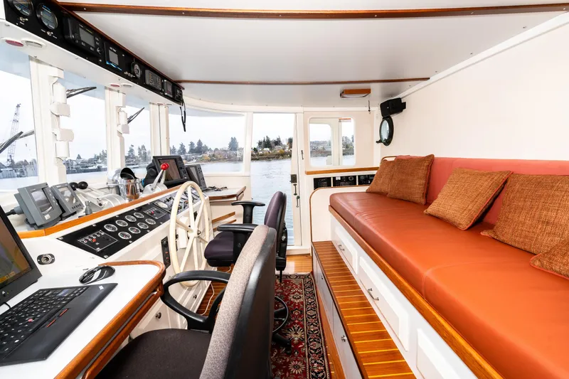 Slide: The Image of Interior of 1966 Willard Marine 47 boat with helm, seating, and navigation equipment. - 38