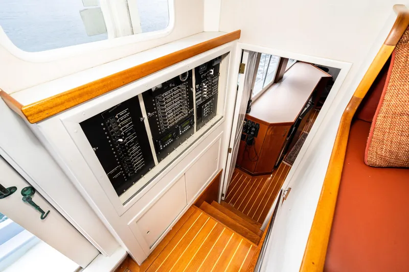Slide: The Image of Interior of 1966 Willard Marine 47, featuring control panels and wooden flooring. - 39