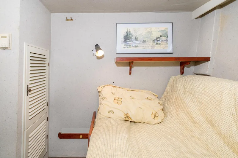 Slide: The Image of Cozy cabin interior of 1966 Willard Marine 47 with artwork and lighting. - 50