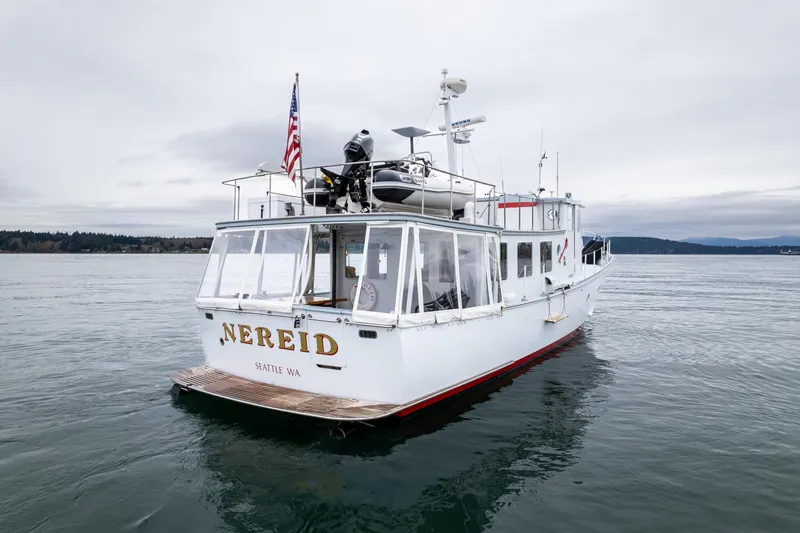 Slide: The Image of 1966 Willard Marine 47 boat "Nereid" on calm waters, Seattle, overcast sky. - 70