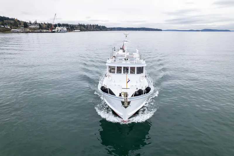 Slide: The Image of Front view of a 1966 Willard Marine 47 boat cruising on calm waters. - 75