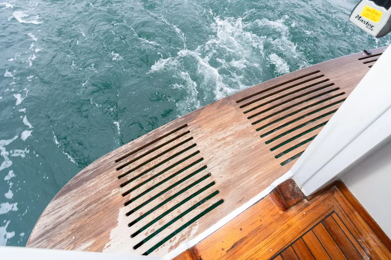 Slide: The Image of Wooden deck of 1966 Willard Marine 47 boat with ocean view. - 8