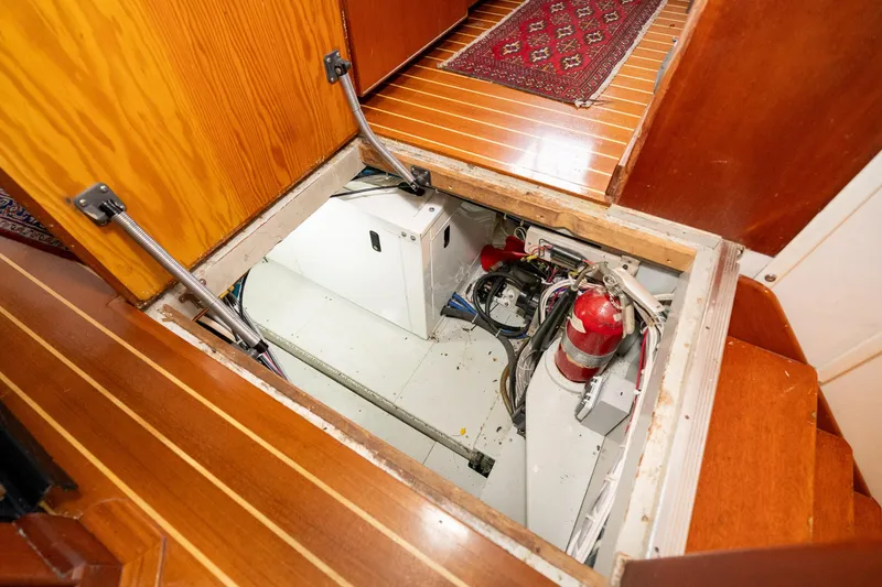 Slide: The Image of Engine compartment of 1966 Willard Marine 47, featuring fire extinguisher and wiring. - 88