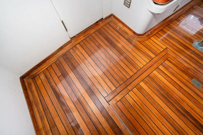 Slide: The Image of Polished wooden floor of 1966 Willard Marine 47 boat interior. - 9