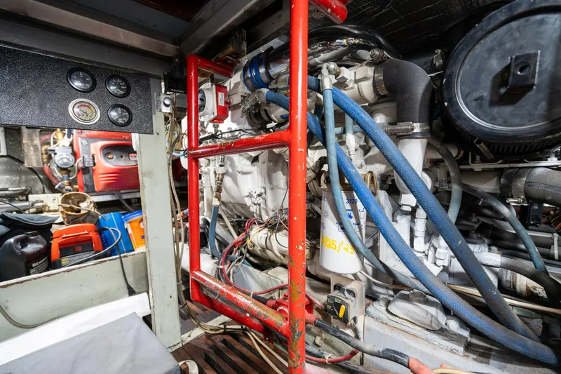 Slide: The Image of Engine room of a 1966 Willard Marine 47, featuring gauges and mechanical components. - 91