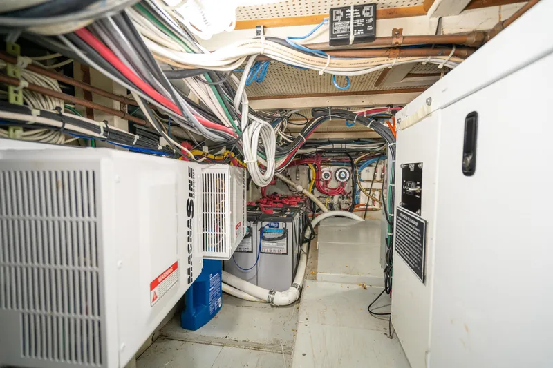 Slide: The Image of Interior of a 1966 Willard Marine 47, showcasing electrical wiring and equipment. - 93