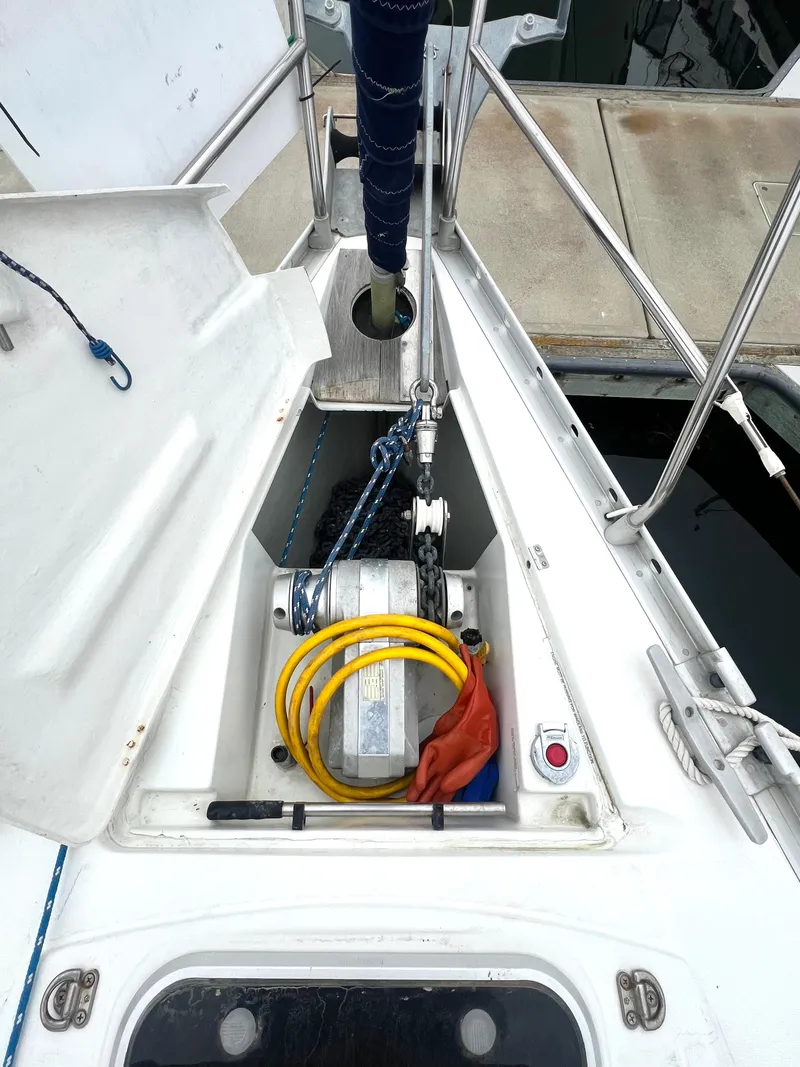 Slide: The Image of Anchor locker of 1993 Beneteau Oceanis 440 sailboat with chain and equipment. - 10
