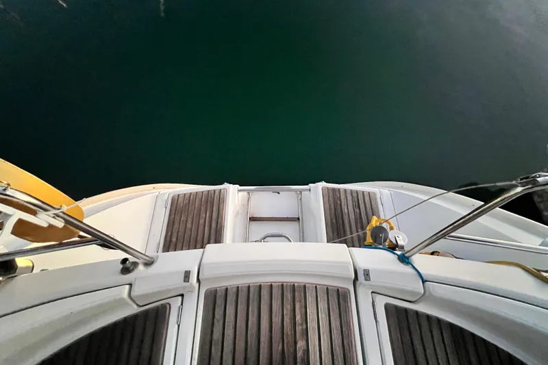 Slide: The Image of Beneteau Oceanis 440 yacht deck, 1993 model, overlooking calm water. - 15