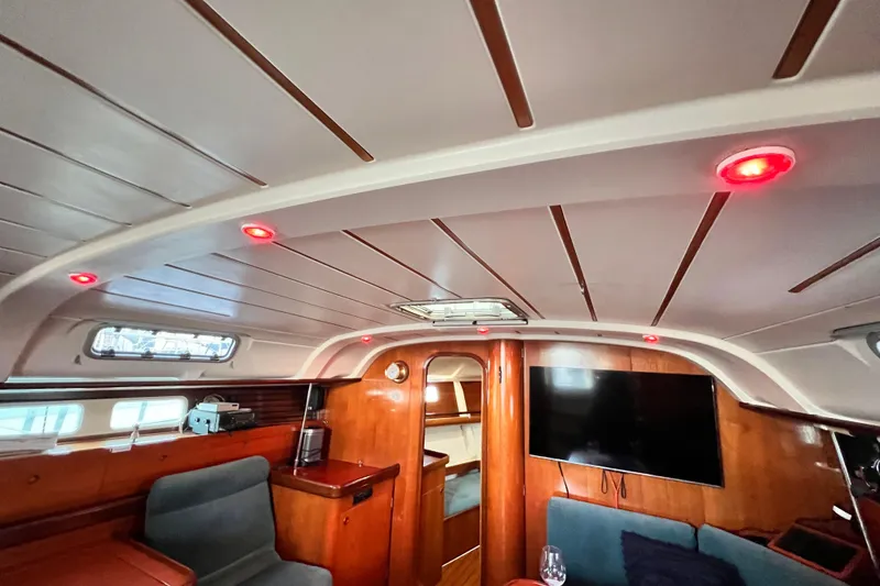 Slide: The Image of Interior of 1993 Beneteau Oceanis 440 yacht with wood finish and modern lighting. - 25