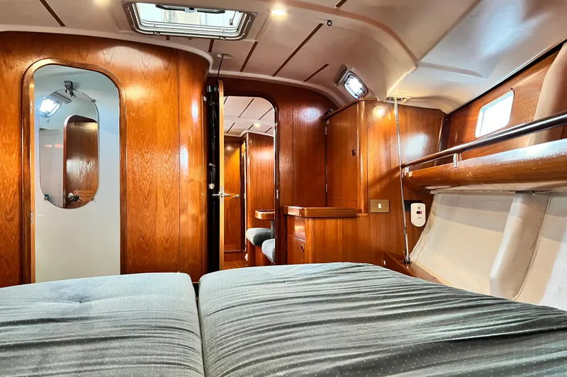 Slide: The Image of Interior of 1993 Beneteau Oceanis 440 yacht with wooden finish and cozy cabin. - 41