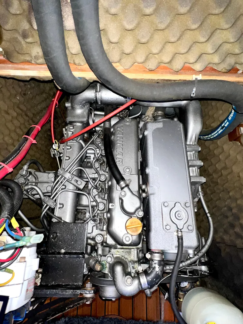 Slide: The Image of Engine compartment of a 1993 Beneteau Oceanis 440 sailboat, showcasing mechanical components. - 48