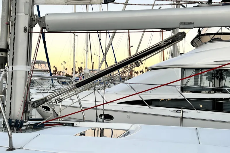 Slide: The Image of Beneteau Oceanis 440 sailboat, 1993 model, docked at marina with masts and rigging. - 7