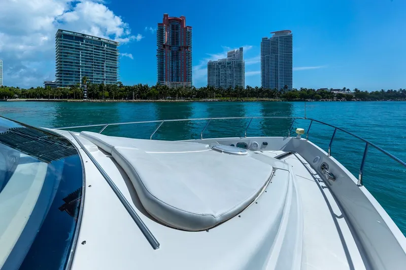 Slide: The Image of Luxury yacht Marquis 59 cruising near modern city skyline, 2005 model. - 10