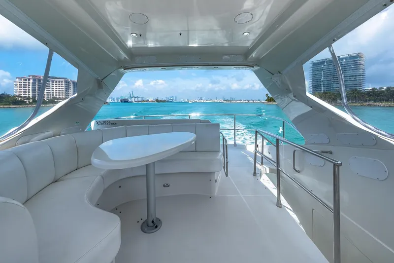 Slide: The Image of Luxurious 2005 Marquis 59 yacht interior with ocean view and modern seating area. - 17