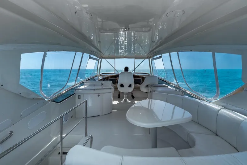 Slide: The Image of Luxurious interior of a 2005 Marquis 59 yacht with ocean view. - 19