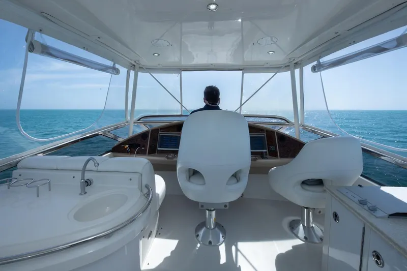 Slide: The Image of Interior view of a 2005 Marquis 59 yacht navigating on open sea. - 21