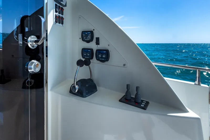 Slide: The Image of Control panel of a 2005 Marquis 59 yacht with ocean view. - 23