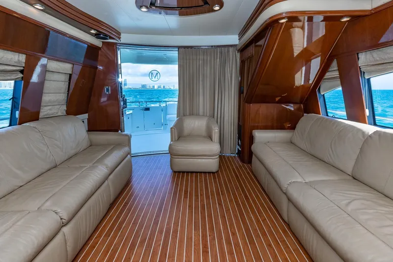 Slide: The Image of Luxurious interior of 2005 Marquis 59 yacht with leather seating and ocean view. - 26