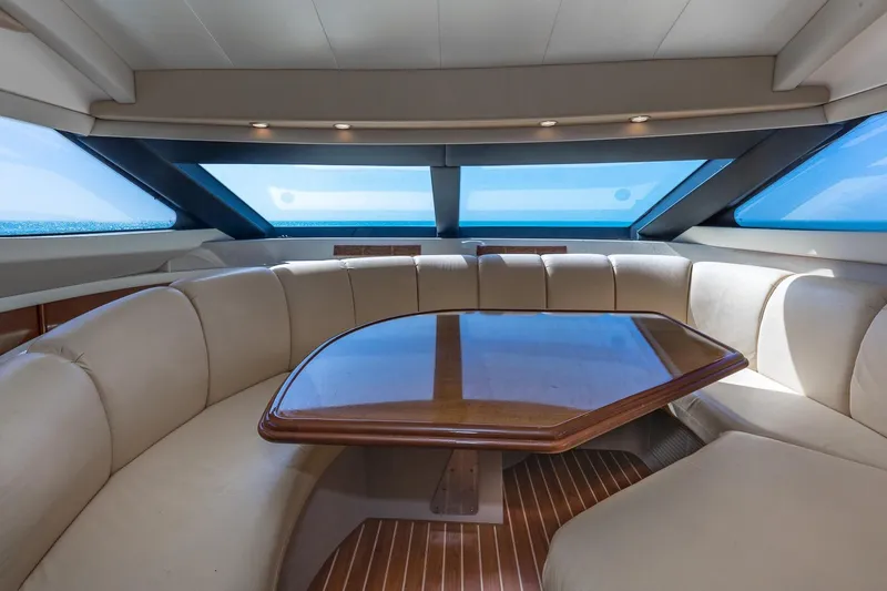 Slide: The Image of Luxurious interior of a 2005 Marquis 59 yacht with elegant seating and panoramic windows. - 30