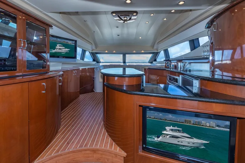 Slide: The Image of Luxurious interior of a 2005 Marquis 59 yacht with elegant wood finishes and modern amenities. - 31