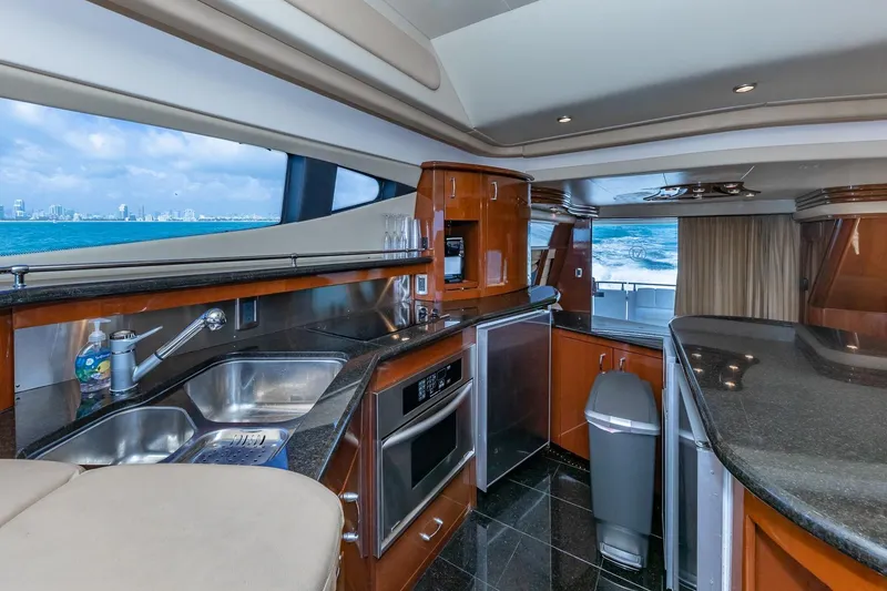 Slide: The Image of Luxurious 2005 Marquis 59 yacht interior with modern kitchen and ocean view. - 32