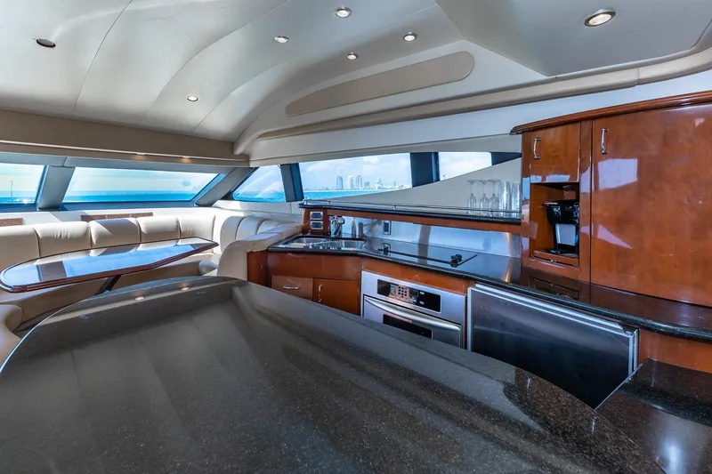 Slide: The Image of Luxurious interior of 2005 Marquis 59 yacht with modern kitchen and dining area. - 33