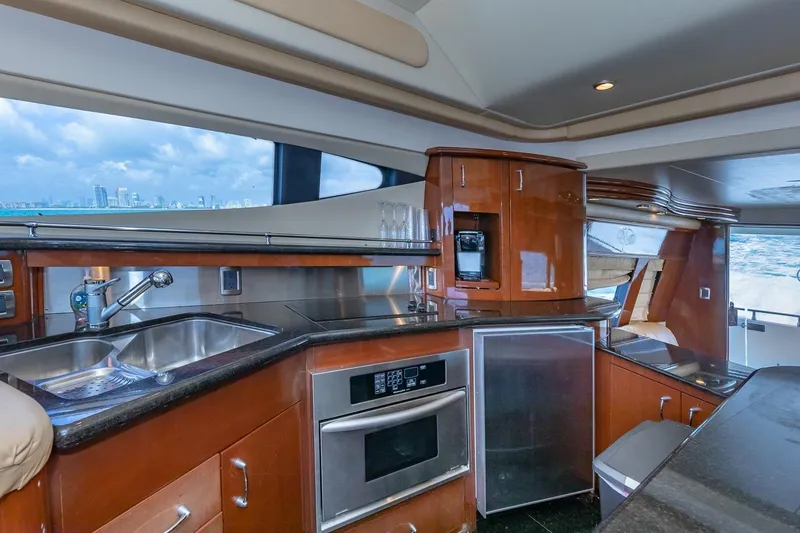 Slide: The Image of Luxurious 2005 Marquis 59 yacht kitchen with modern appliances and ocean view. - 34
