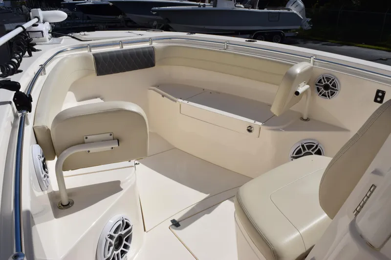 Slide: The Image of 2022 Cobia 280 Center Console boat interior with seating and speakers. - 13