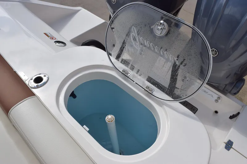 Slide: The Image of 2022 Cobia 280 Center Console livewell with open lid, showcasing interior details. - 27