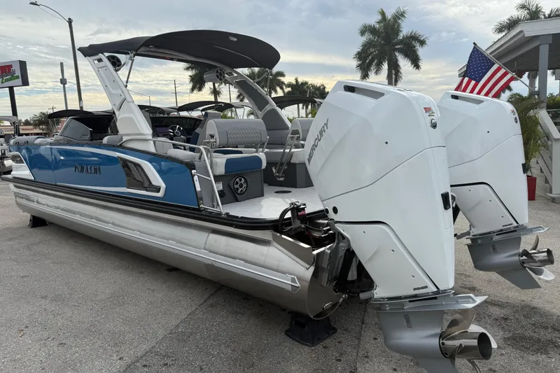 Slide: The Image of 2026 Avalon 2785 Excalibur LTD boat with twin Mercury 425hp engines, parked outdoors. - 10