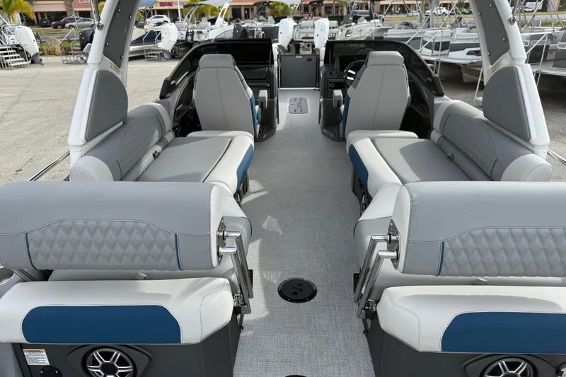 Slide: The Image of 2026 Avalon 2785 Excalibur LTD boat interior with quad loungers and modern design. - 11