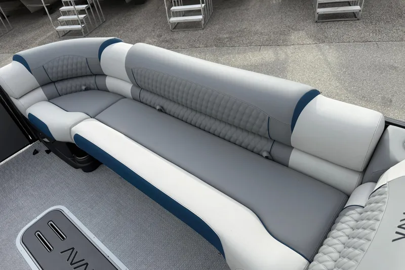 Slide: The Image of Luxurious seating on 2026 Avalon 2785 Excalibur LTD boat, featuring elegant gray and blue upholstery. - 16