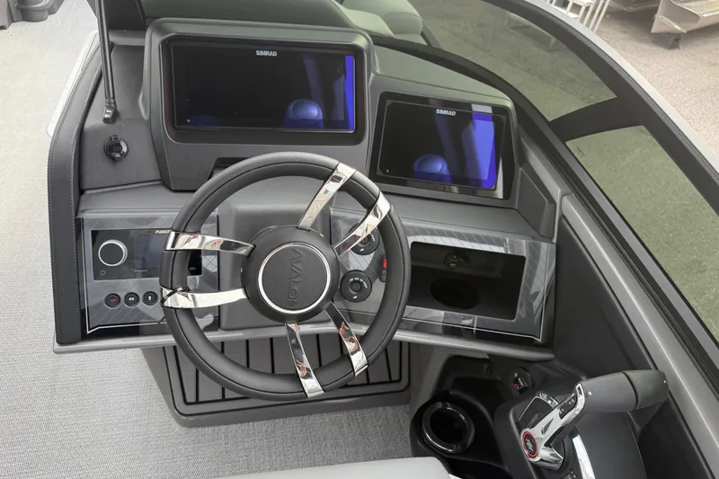 Slide: The Image of 2026 Avalon 2785 Excalibur LTD boat dashboard with modern controls and dual Simrad displays. - 27