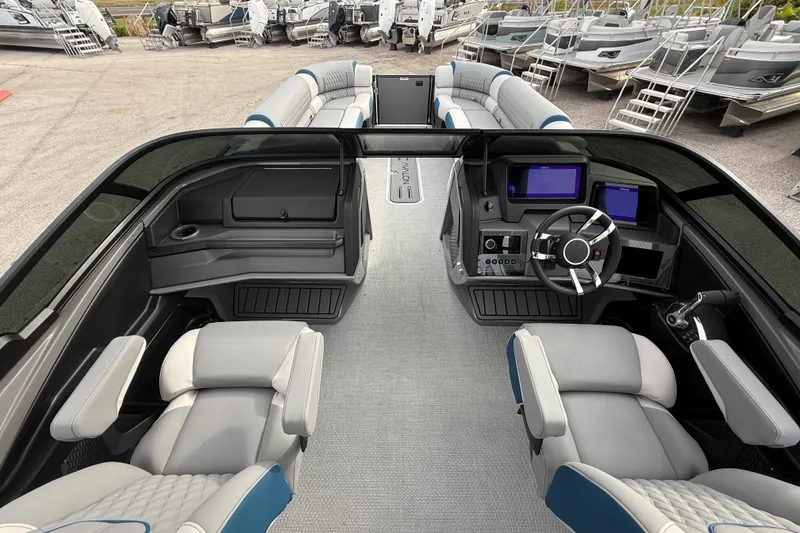 Slide: The Image of 2026 Avalon 2785 Excalibur LTD boat interior with modern dashboard and luxurious seating. - 28