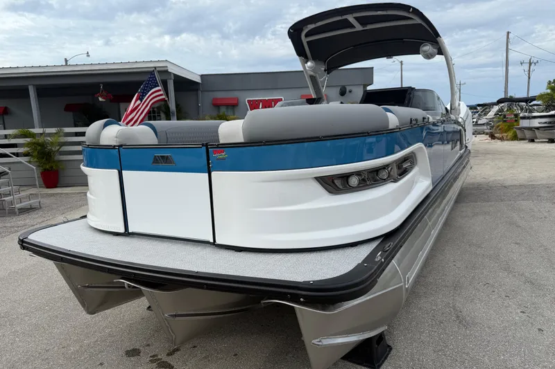 Slide: The Image of 2026 Avalon 2785 Excalibur LTD boat with quad lounger and twin Mercury 425hp engines. - 3