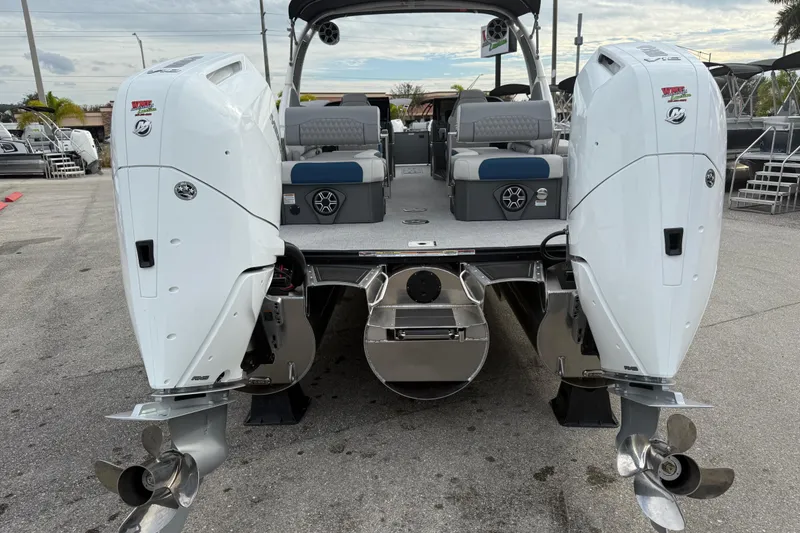 Slide: The Image of 2026 Avalon 2785 Excalibur LTD boat with twin Mercury 425hp V-10 engines, rear view. - 8