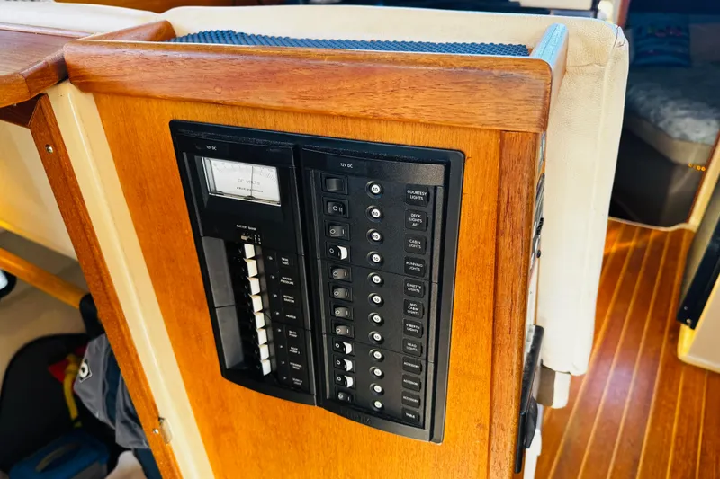 Slide: The Image of Electrical panel on 2012 Ranger Tugs R-31 boat with wooden interior. - 22