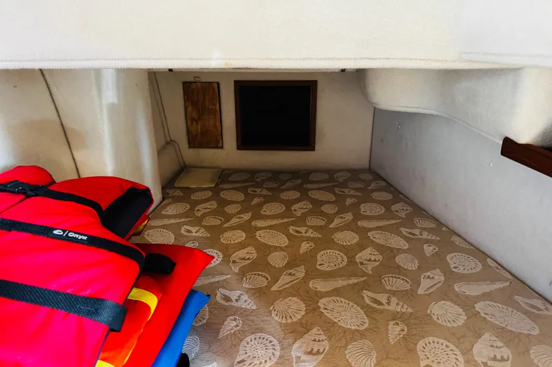 Slide: The Image of Interior cabin of 2012 Ranger Tugs R-31 with patterned flooring and life jackets. - 25