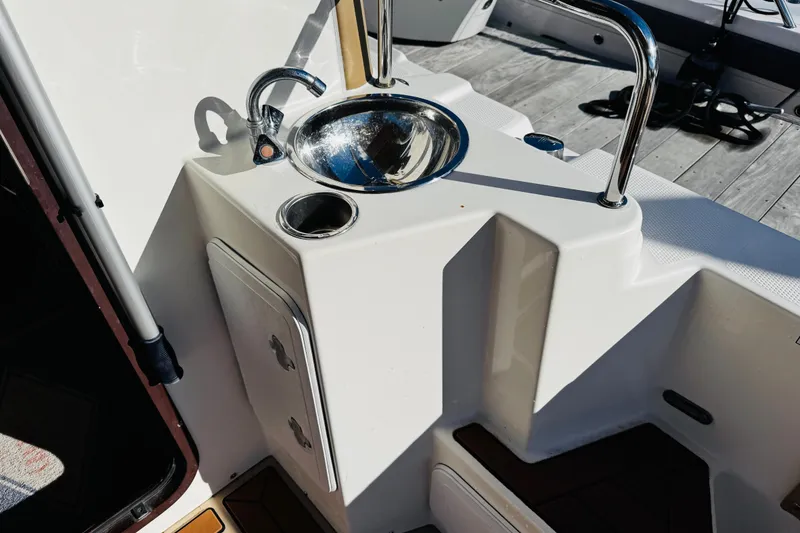 Slide: The Image of 2012 Ranger Tugs R-31 boat sink and storage area on deck. - 32