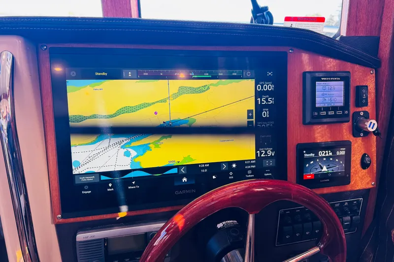 Slide: The Image of Dashboard of 2012 Ranger Tugs R-31 with Garmin navigation display and controls. - 8